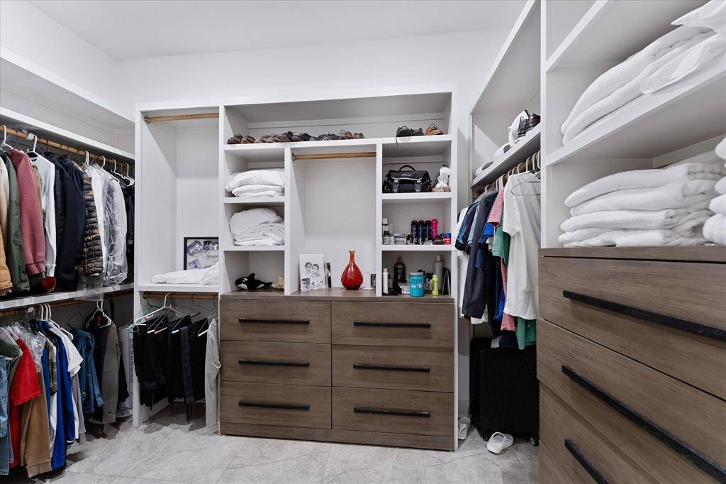 Massive walk-in closet features built-ins and plenty of room for you!
