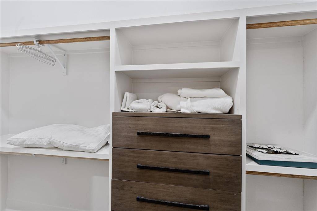 Walk-in closet; close up detail of built-ins found here- nice!