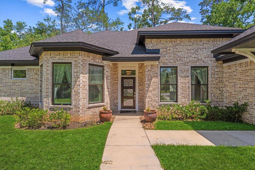 Warm and inviting entrance greets you as you enter this custom home.
