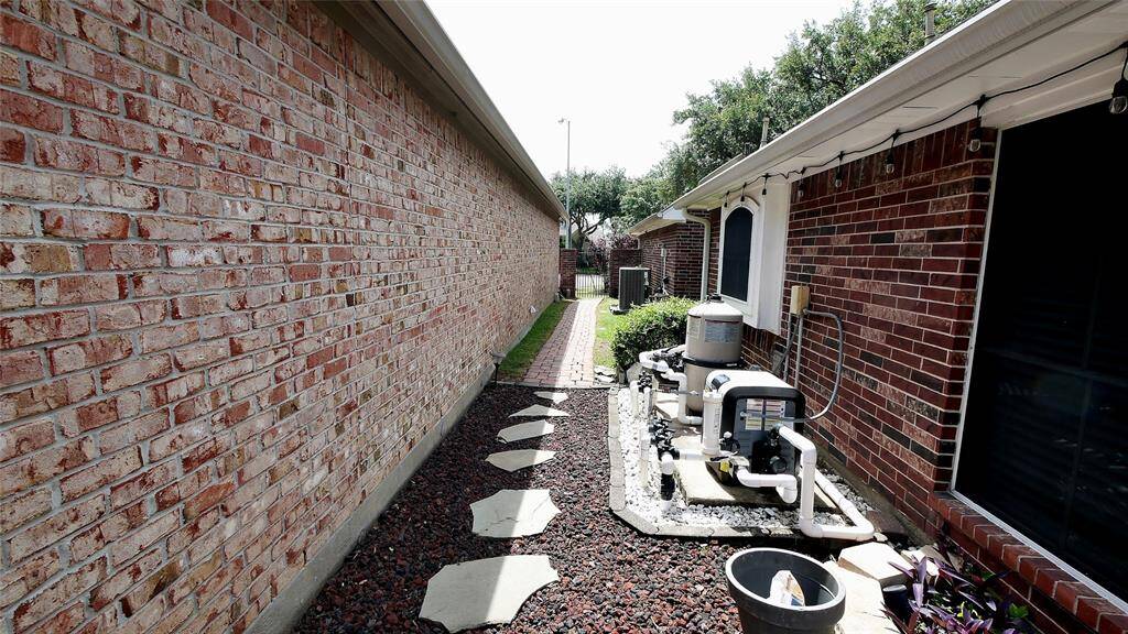 Side of House where pool equipment is locacted
