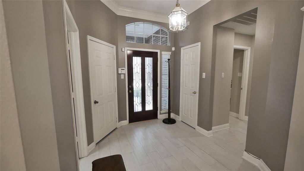 Front Door leading to the hallway of one of the bedrooms