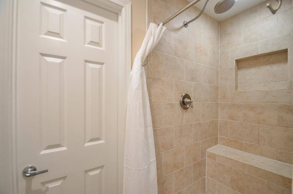 Downstairs bath complete with shower