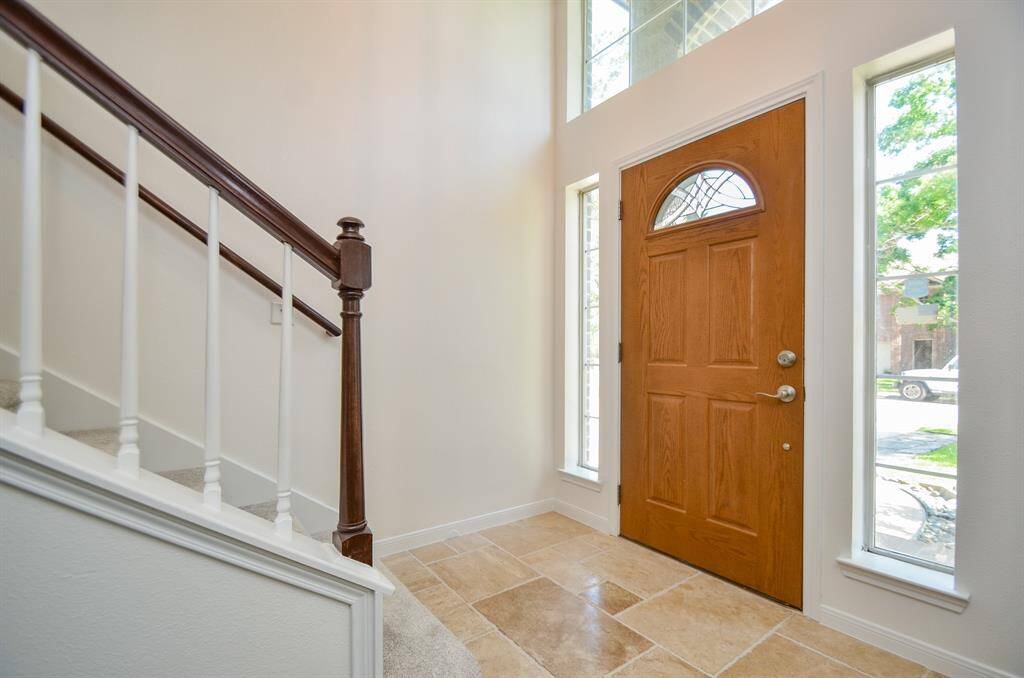 Inviting Entryway with Travertine Tile