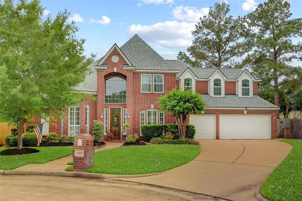 Charming two-story brick home with a welcoming front entrance, beautifully manicured lawn, and a spacious three-car garage. Located in a quiet cul-de-sac, this property features classic architectural details and mature trees, offering a serene and inviting atmosphere.