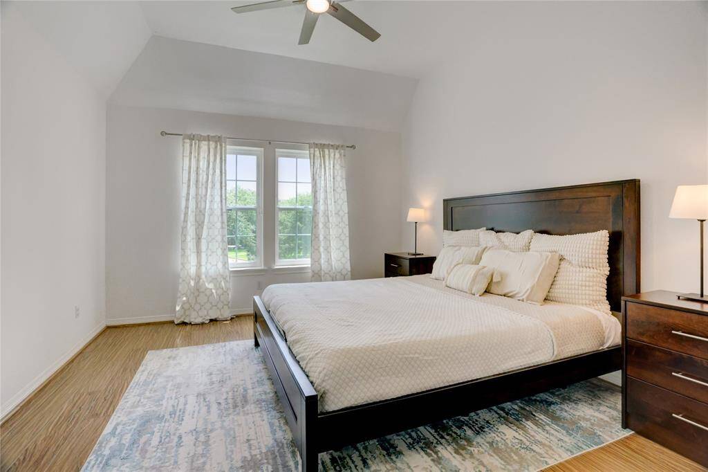 Discover the inviting third bedroom, featuring abundant natural light and a cozy atmosphere.