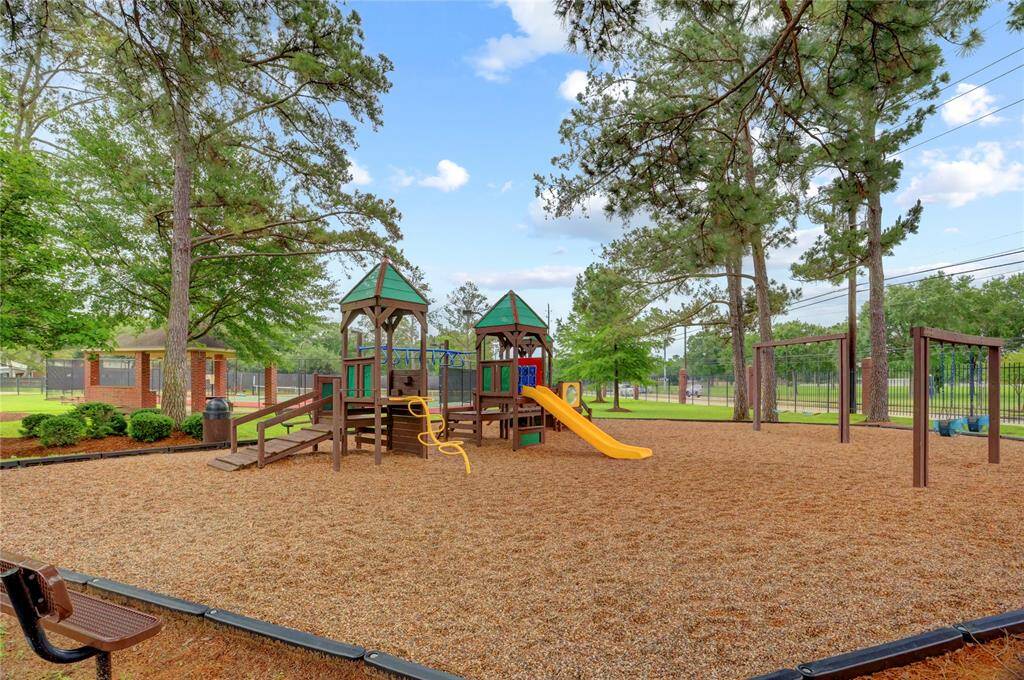 Residents can enjoy a charming playground, perfect for family fun.