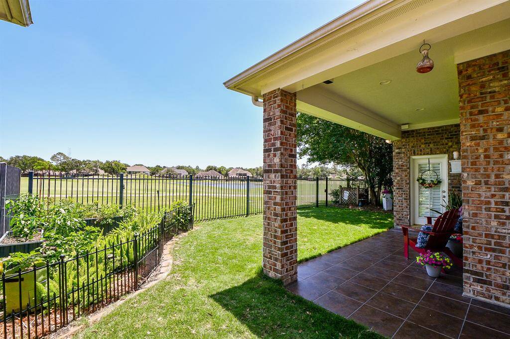 Precious backyard with vegetable gardens, views and covered patio.