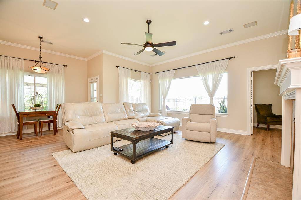 Light and bright living room open to breakfast room and kitchen.