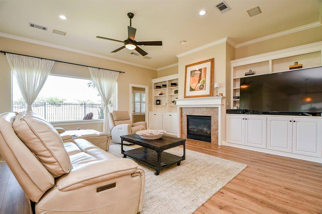 Cozy fireplace and built-in bookshelves really finish the look of this room.