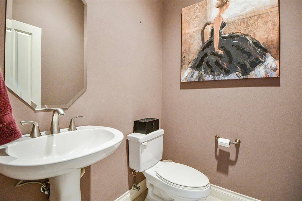 Spacious half bathroom.