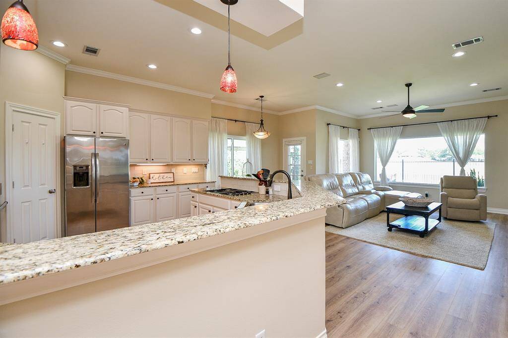 View of Kitchen opening up to living room.