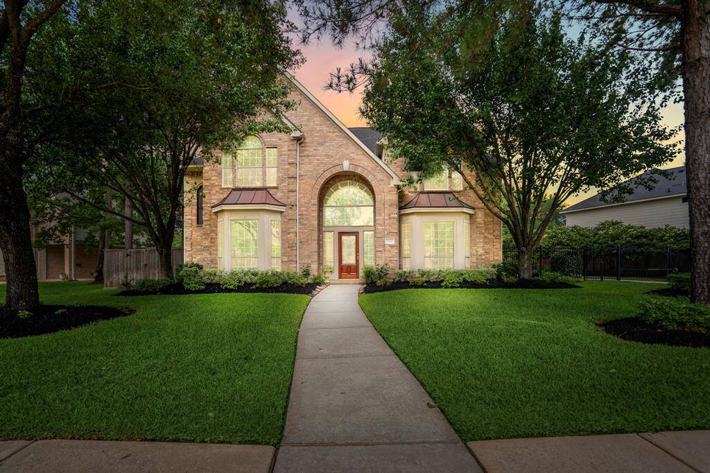 Beautiful traditional home located at 1415 Hatchmere Place, offers a brick elevation and framed by majestic shade trees.