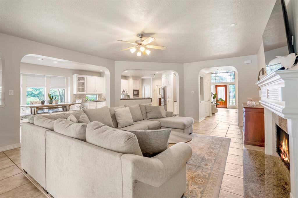 The open floor plan offers a light and breezy feel, with easy access to the kitchen, breakfast room as well as the  backyard patio.