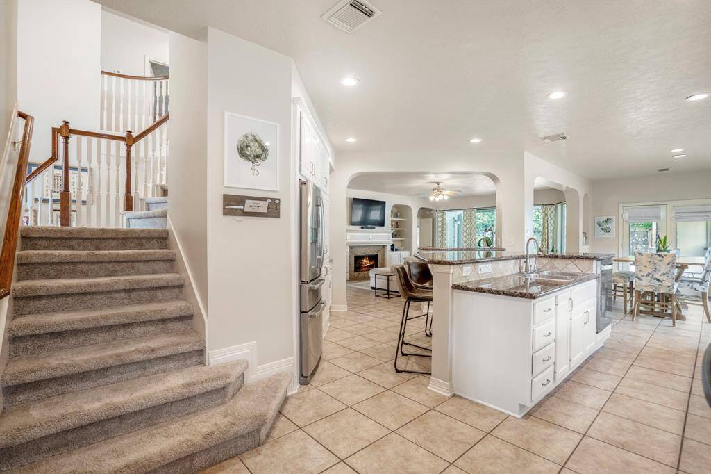 From the kitchen / breakfast area you have easy access to the second floor living with the return staircase.