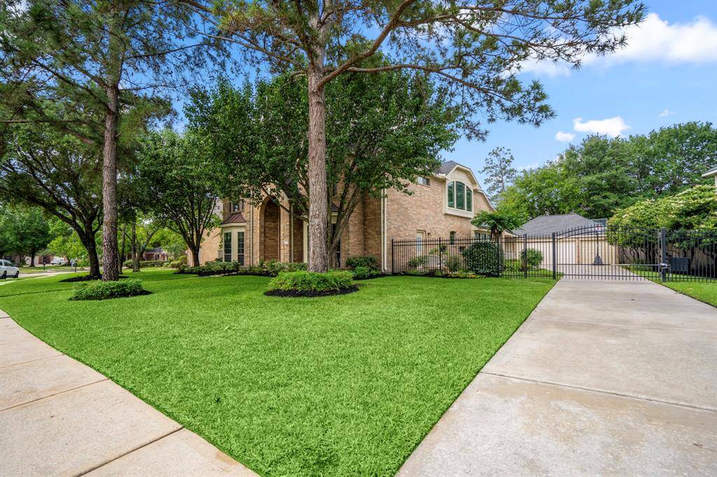 The property offers a private gated driveway that leads to a 3-car detached garage, and is located in premier master planned community of Gleannloch Farms.