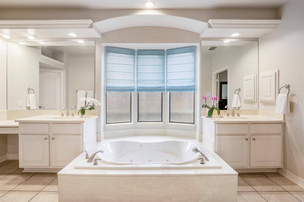 The bathroom offers lots of natural and overhead lighting that makes this the ideal place to get ready for your day or evening out.