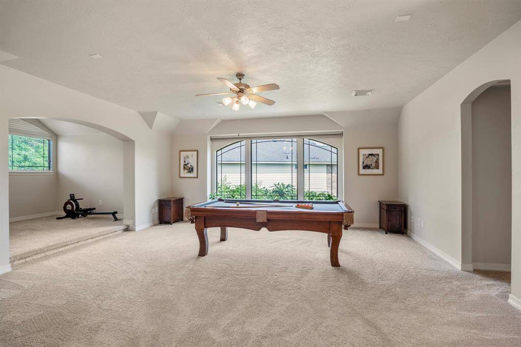 Upstairs you will find a huge gameroom, 20 x 18 - which is spacious enough for many versatile options, it has a secret closet, study nook as well.