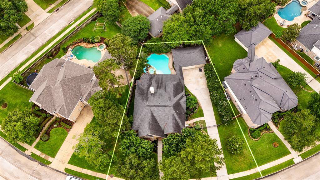 An aerial view of the home and pool, showing you the maximum use of living space on the lot.