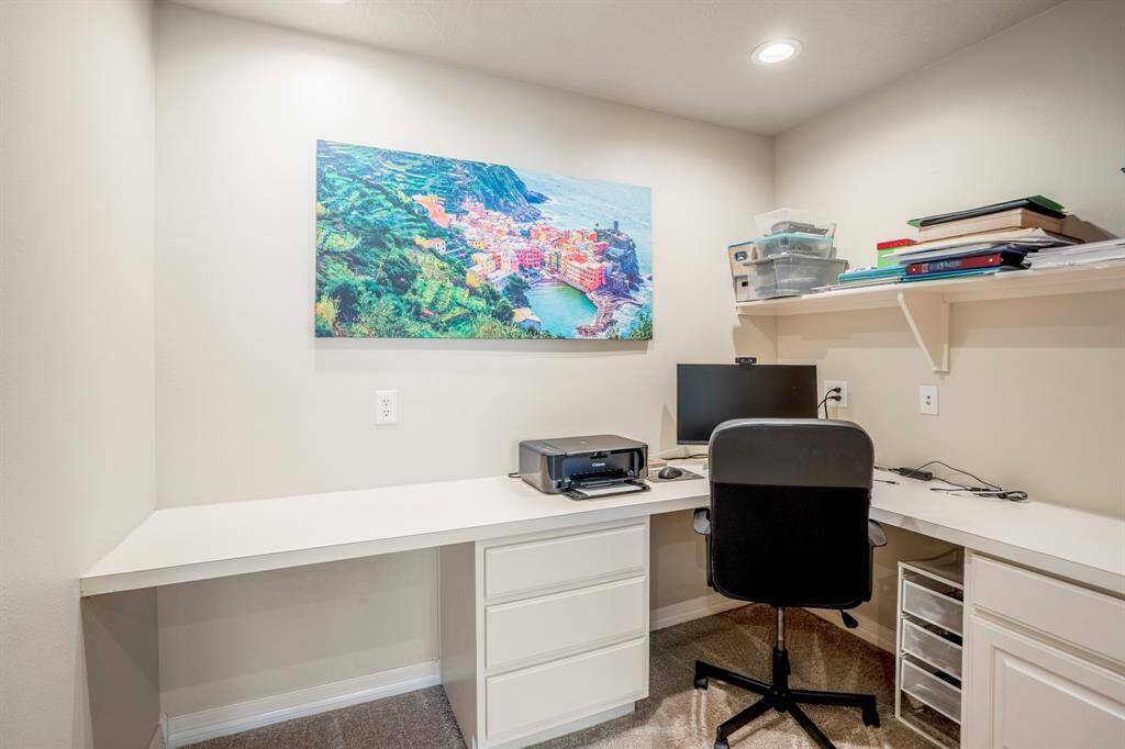 An ideal space for work or homework offering excellent lighting, storage space and a built-in desk.