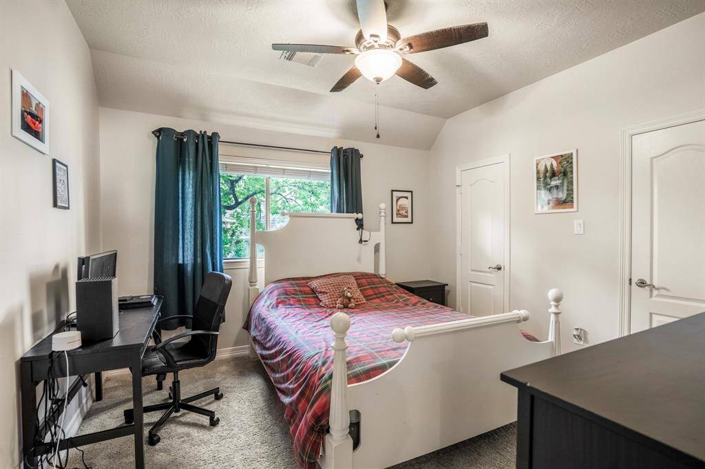 All the bedrooms offer spacious rooms.  This is the second bedroom that is located upstairs, with lots of windows that allow for natural lighting.