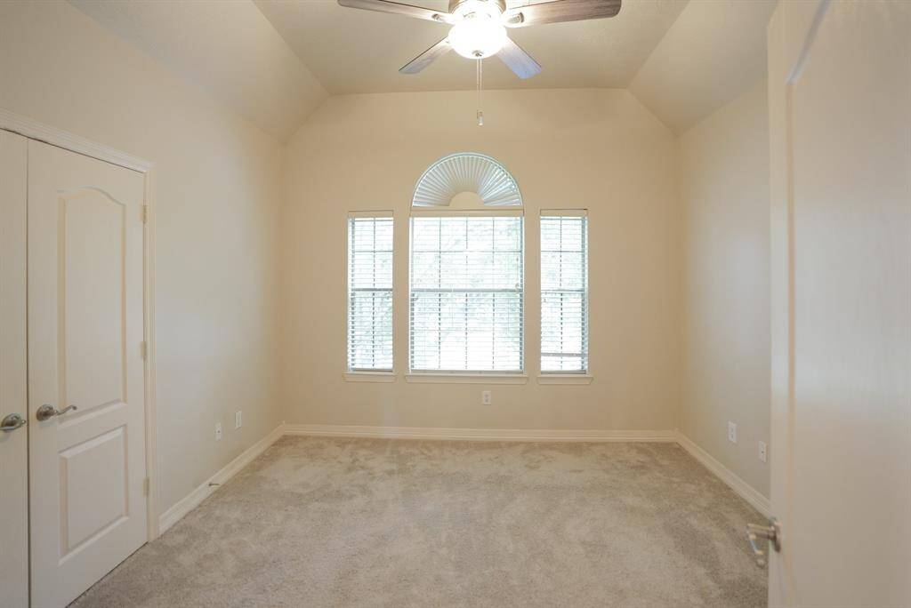 The fourth bedroom offers lots of natural light, soft neutral tones and a good size closet.