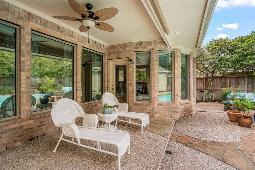 Relax and enjoy a glass of wine while watching the family enjoy cooling off in the sparkling pool.