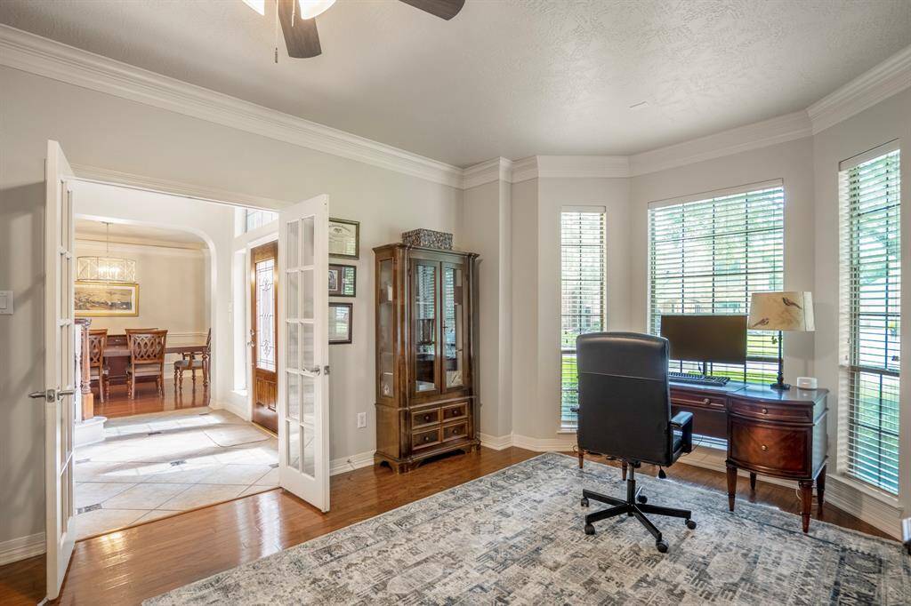 French doors lead to the study / work from home office area (which is versatile and could by used as a flex space).