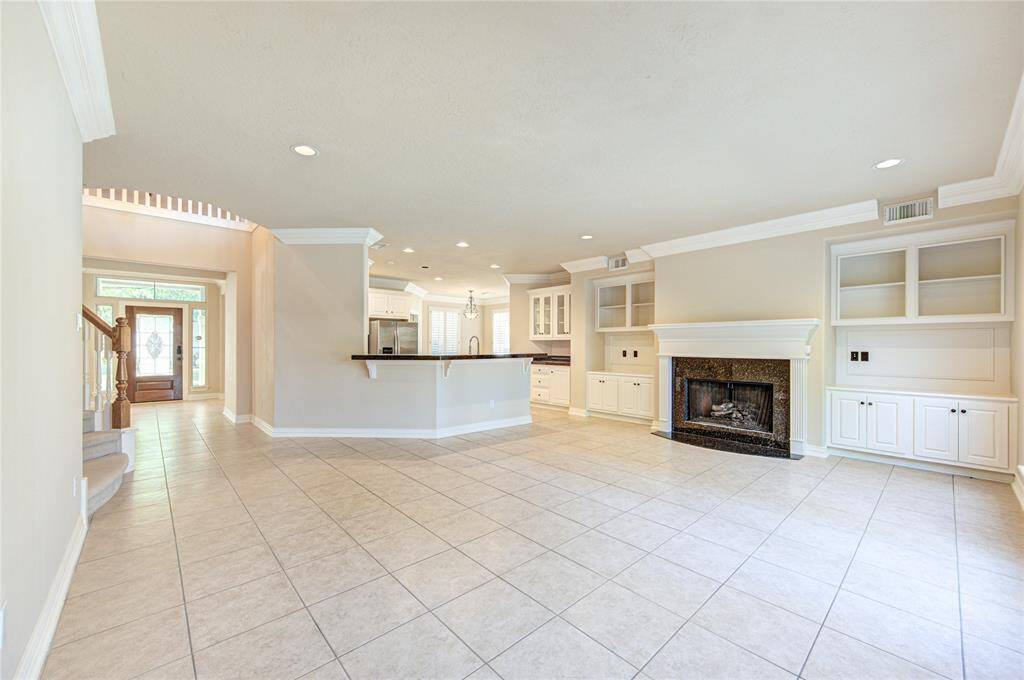 Family Room, open to kitchen offering views onto the backyard private pool