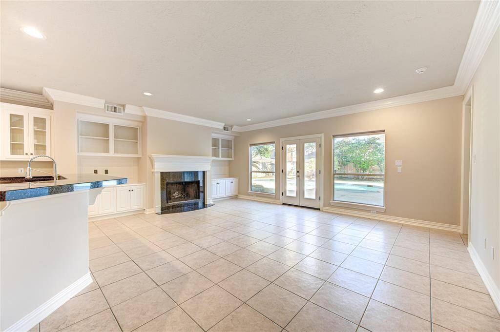 Family Room, open to kitchen offering views onto the backyard private pool