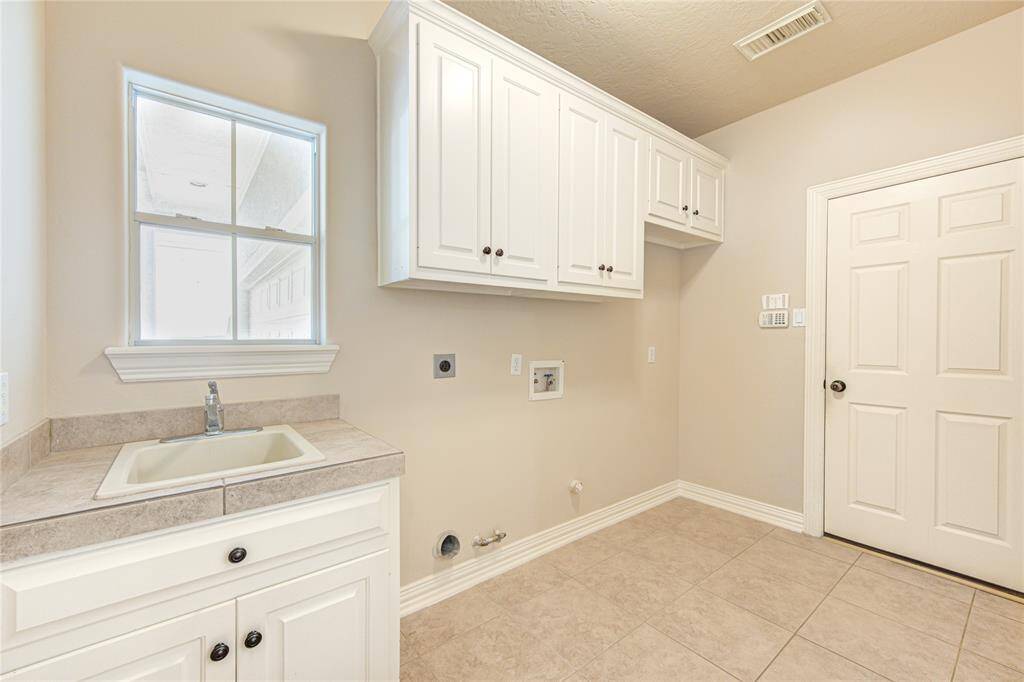 Utility room located off of breakfast area, Washer/Dryer will be provided, upon request