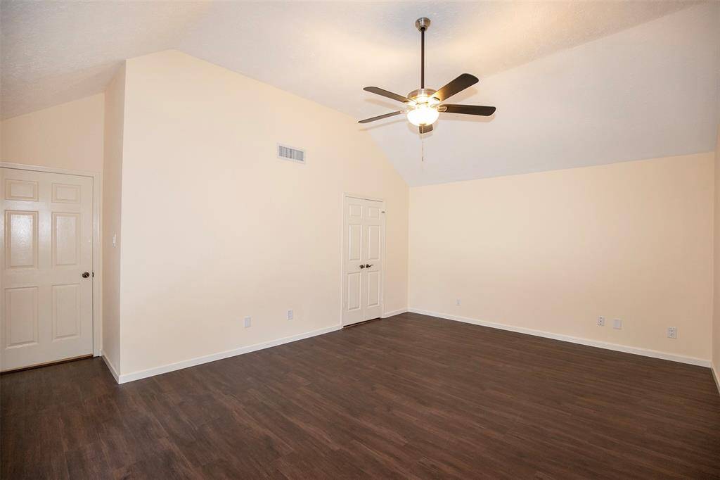 The primary bedroom features an elevated ceiling.