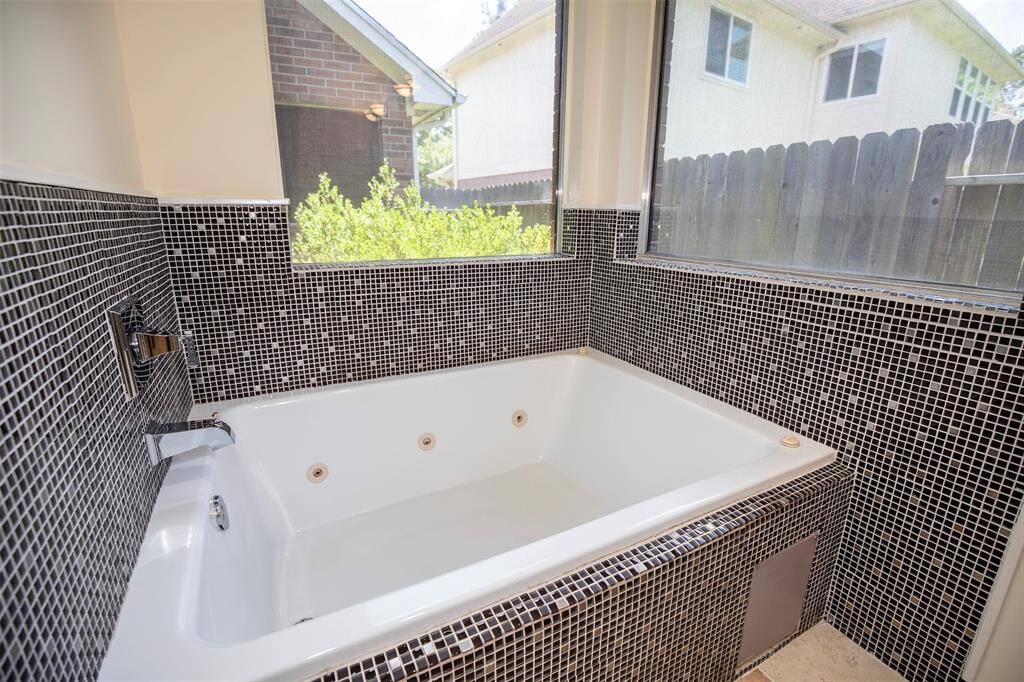 This large jetted tub is the perfect place to relax after a long day.