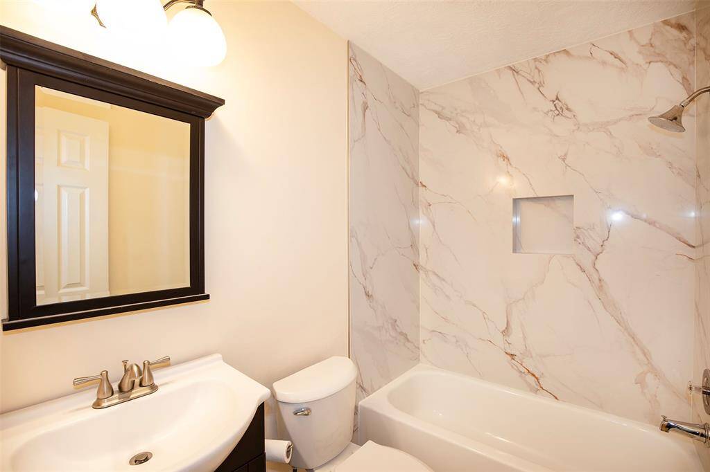 The guest bathroom is thoughtfully designed.