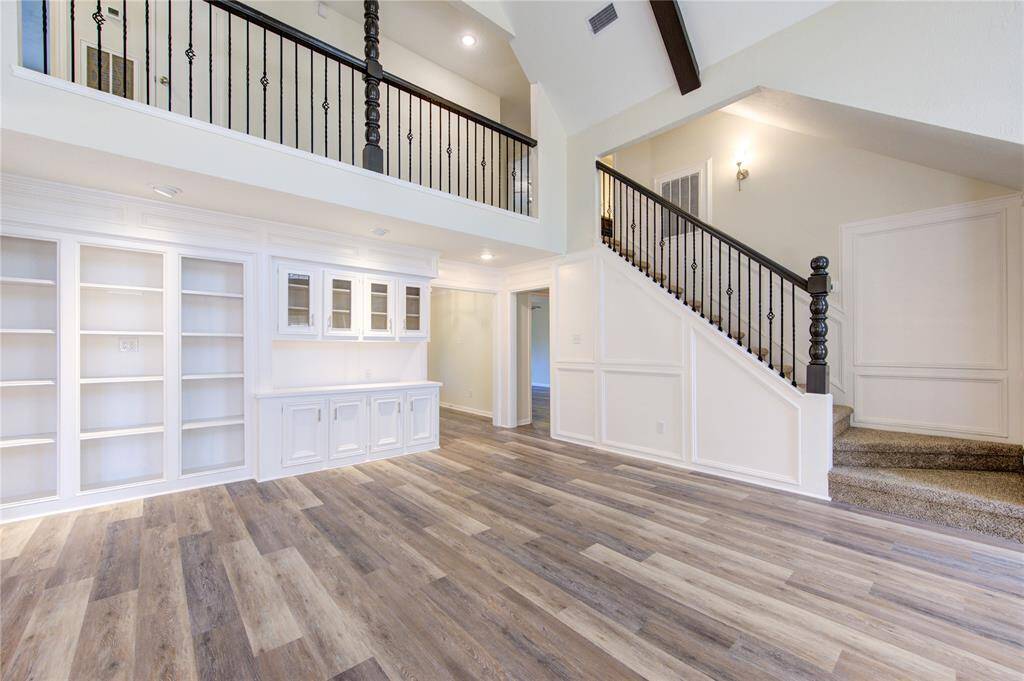 Beautiful built in's and new iron baluster stair railing!