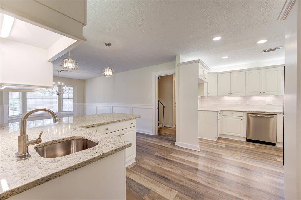 In the kitchen, you will find a wet bar areas with additional storage, bar sink, and a sit up bar.