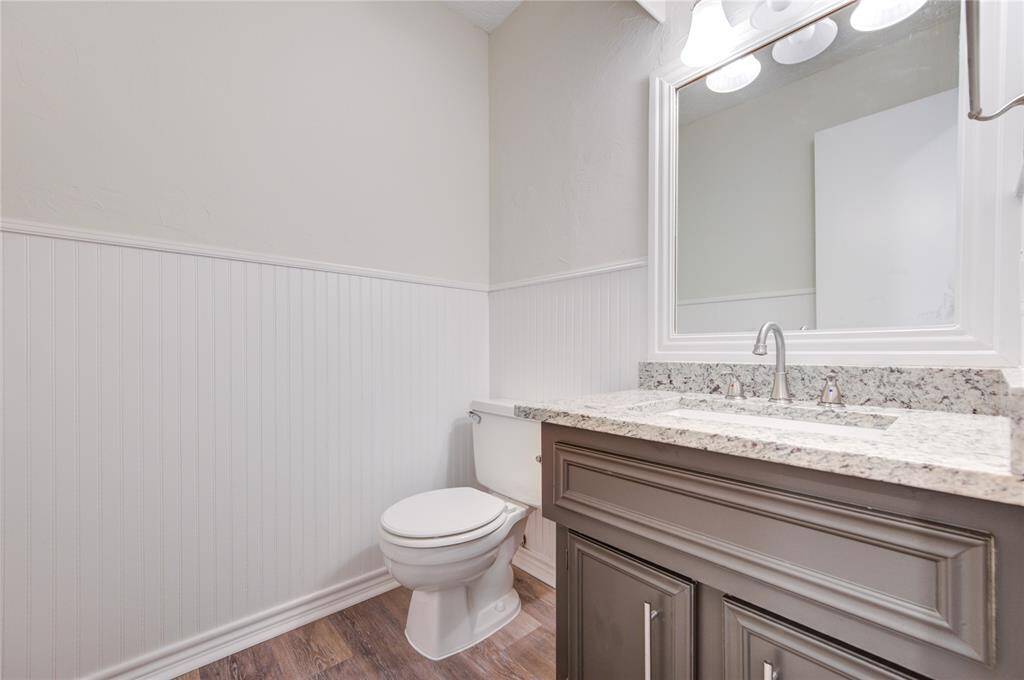 Half bath with new granite, faucet, and fixtures.