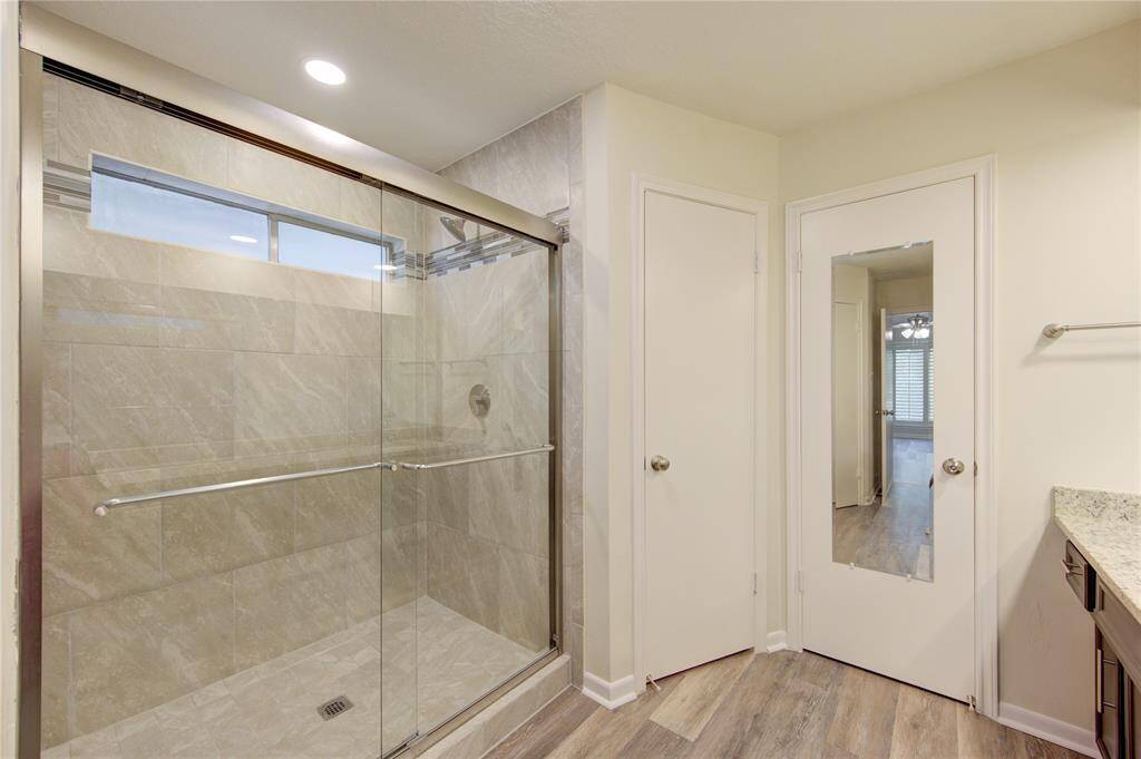The primary bath has a brand new shower with new faucet and shower door.
