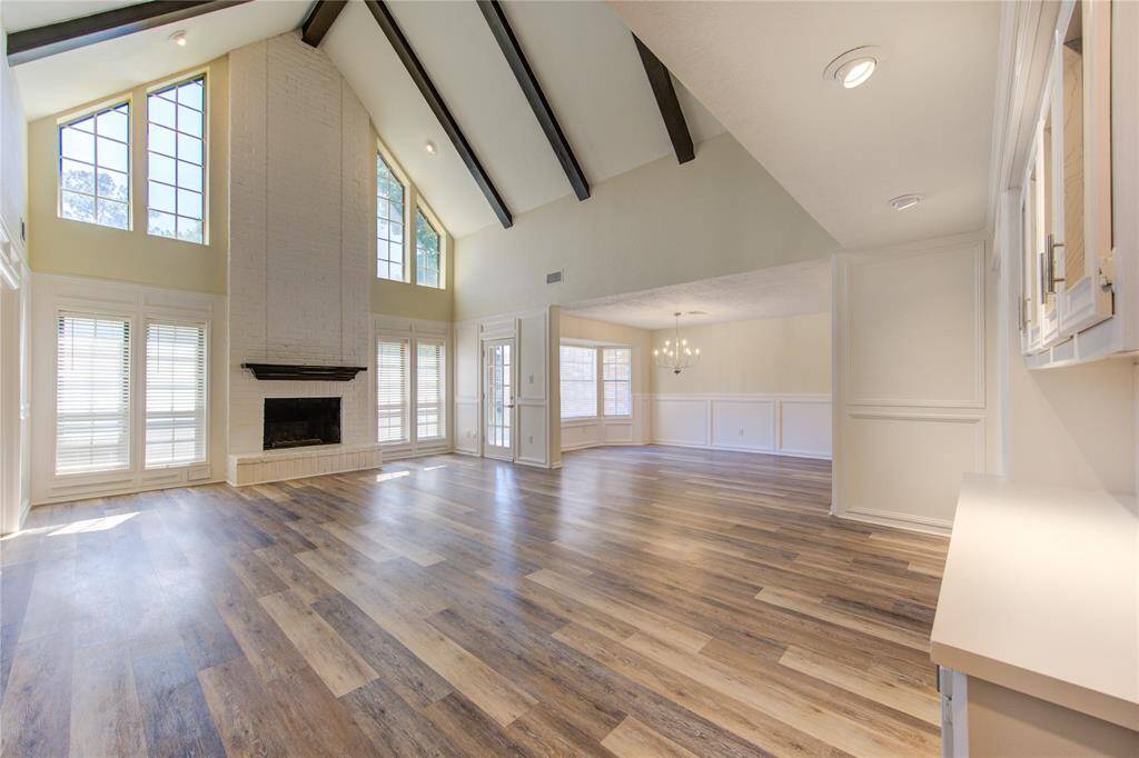 This enormous family room is open to the second floor and is bright and airy with lots of natural light.