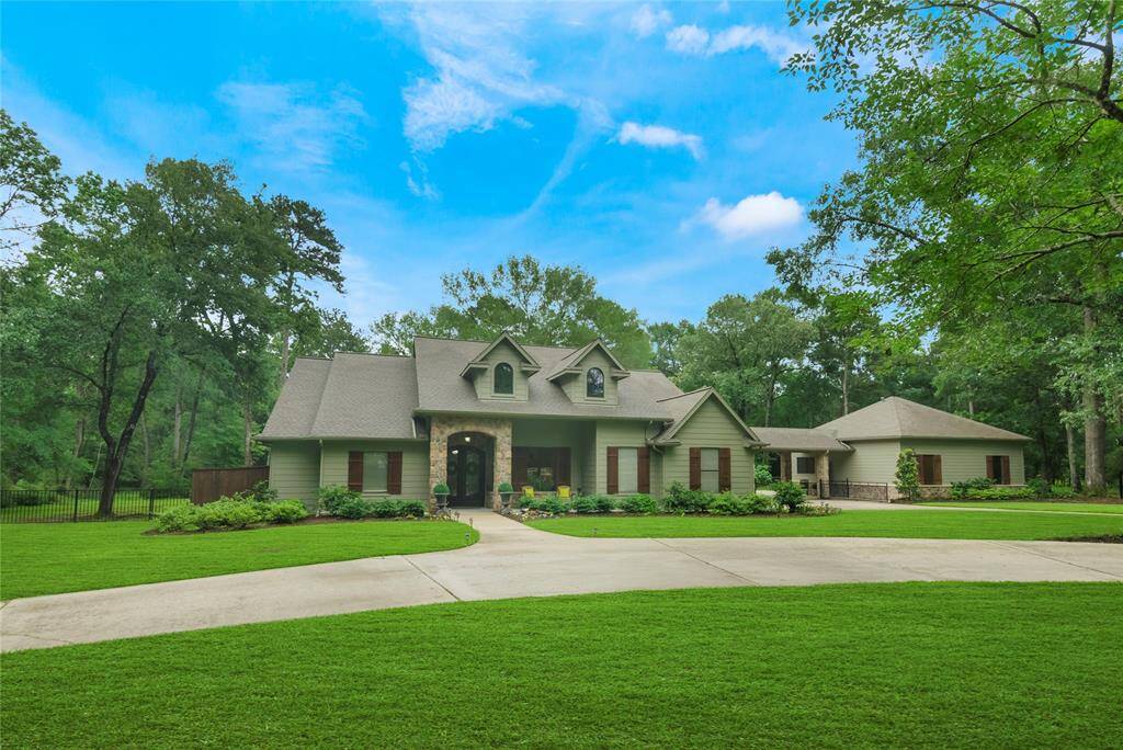 Welcome to this beautifully maintained one-story home nestled on 5 acres, surrounded by mature trees, designed flower beds and lush landscaping. This property offers the perfect balance of charming elegance and function with thoughtfully kept grounds that invite peaceful living. This circular driveway offers ample space to accommodate multiple vehicles. The new roof was installed in 2023.