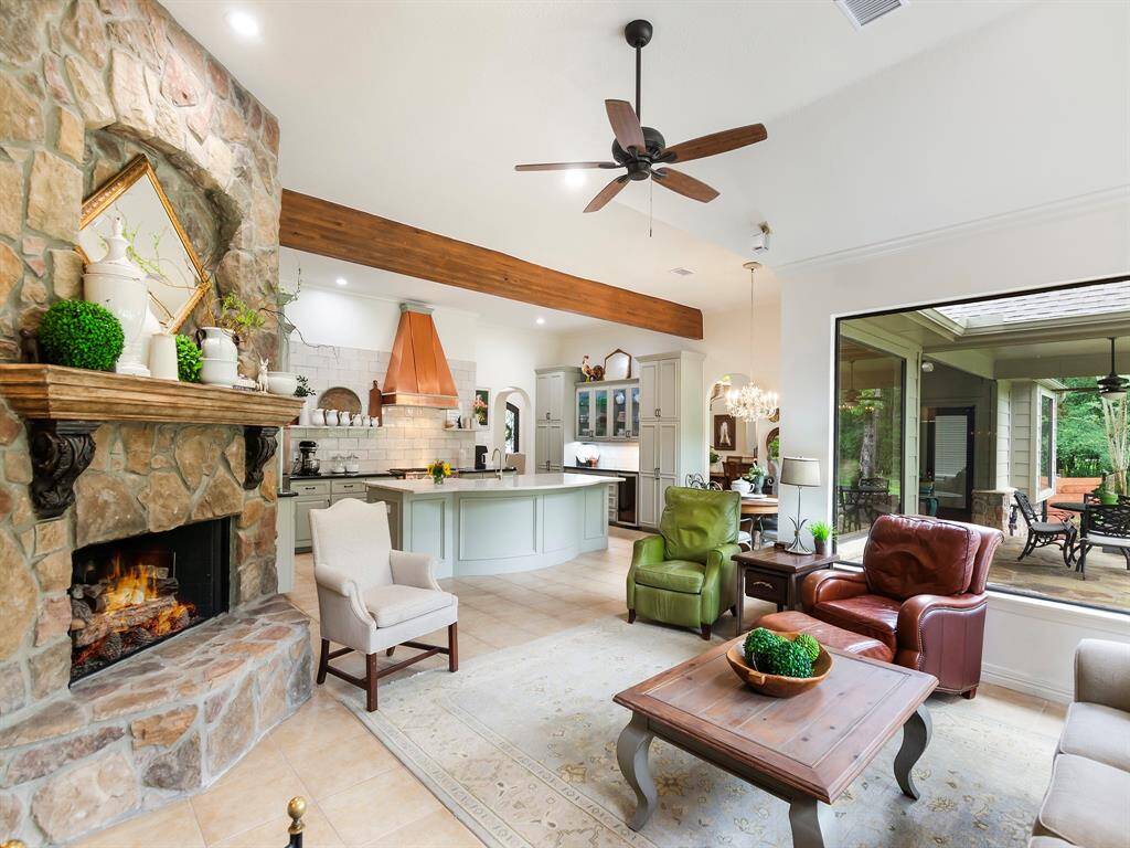 This open concept design perfectly blends the rooms together offering a cohesive and spacious layout filled with natural light.