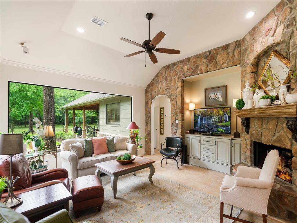 The living room with it's expansive seamless window, offers a serene and inviting space. a perfect spot to relax and enjoy the view.