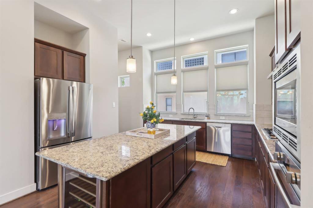 Kitchen features large windows for plenty of natural sunlight