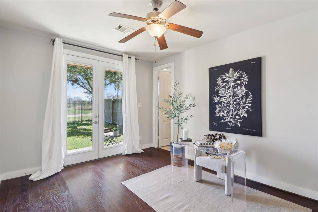 First floor bedroom with double doors overlooking back yard and hike & bike trail