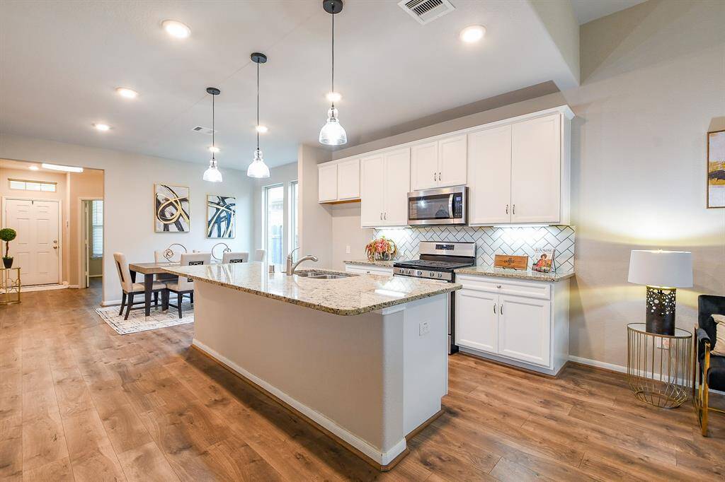 Open paths make tasking a breeze in this special kitchen, with the stairway easily accessible.