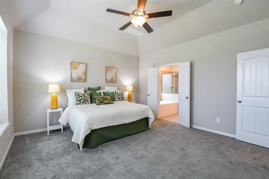 Lush carpeting and hand rails ensure safety on the staircase.