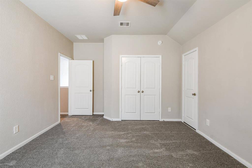 This secondary bedroom on the 2nd floor, sits just off the staircase.