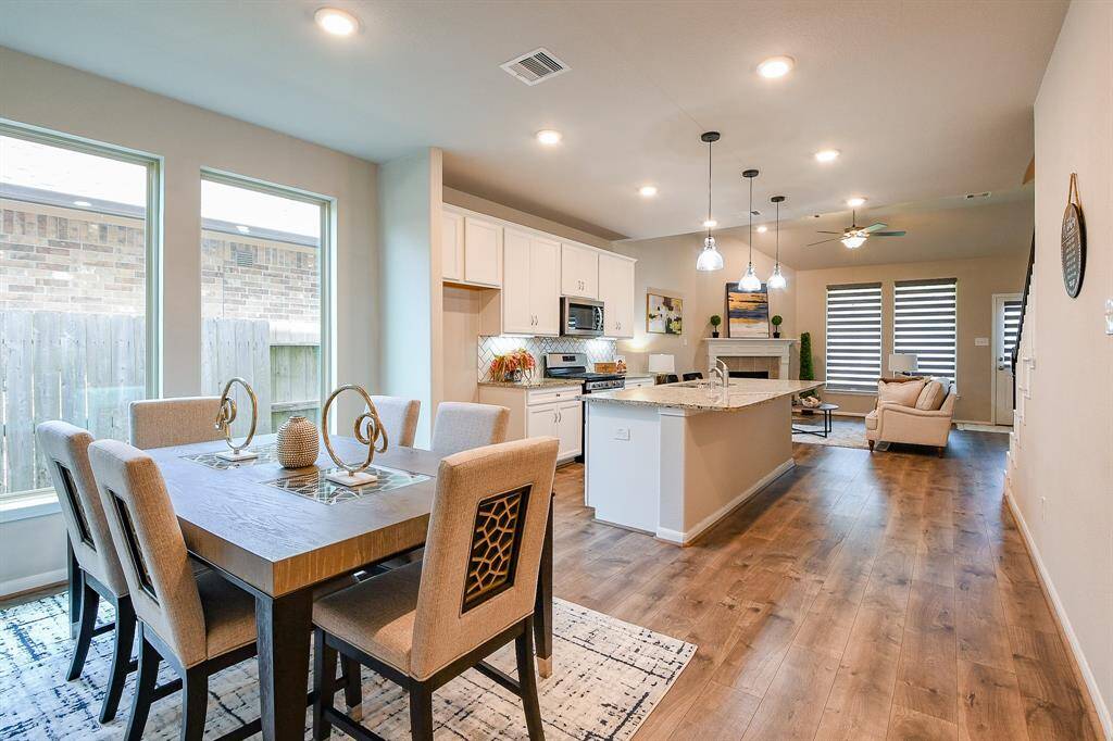 What's more inviting than a cushioned swing on this generous front porch, shared with the covered front entry? Inside this 2-story beauty are 3 bedrooms, 2-1/2 baths, all occupying a 5,400 square-foot-lot with 1,867 square feet of interior living space.