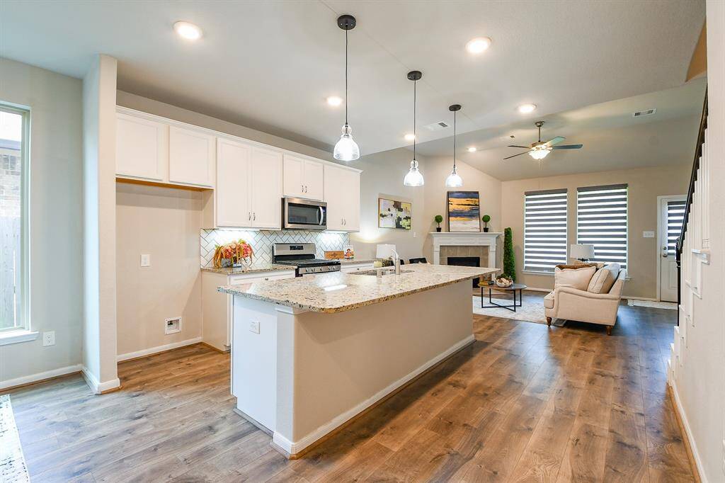 This cozy front room --- which can serve as a private home office, if desired --- sits behind classic french doors off the main hallway.