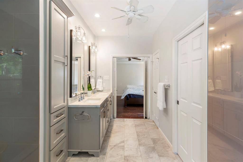 Alternate view of vanity and linen storage cabinetry