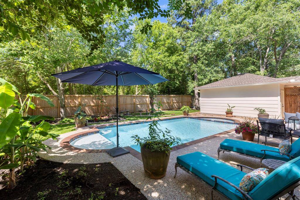 The backyard is a true retreat, featuring a newly resurfaced pool and spa, an expansive patio and deck for entertaining, and a bonus green space perfect for play or relaxation. There is a green space buffer behind the fence and no neighbors behind!